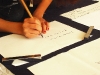 Aoi writing calligraphy